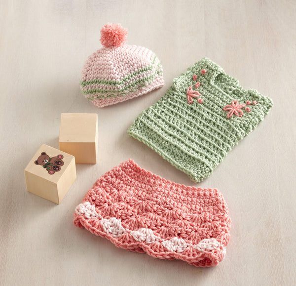 Olivia Doll Outfit (Skirt, Top and Hat) free crochet pattern by Lion Brand Yarn